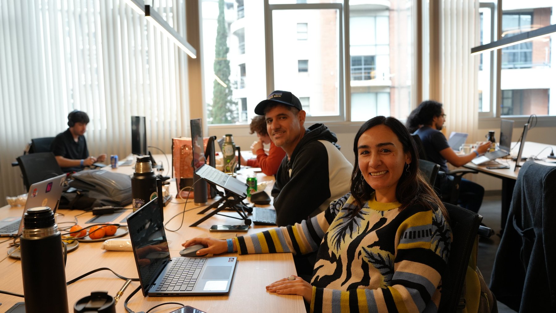Builders at the Aleph Hub tables during the hackathon