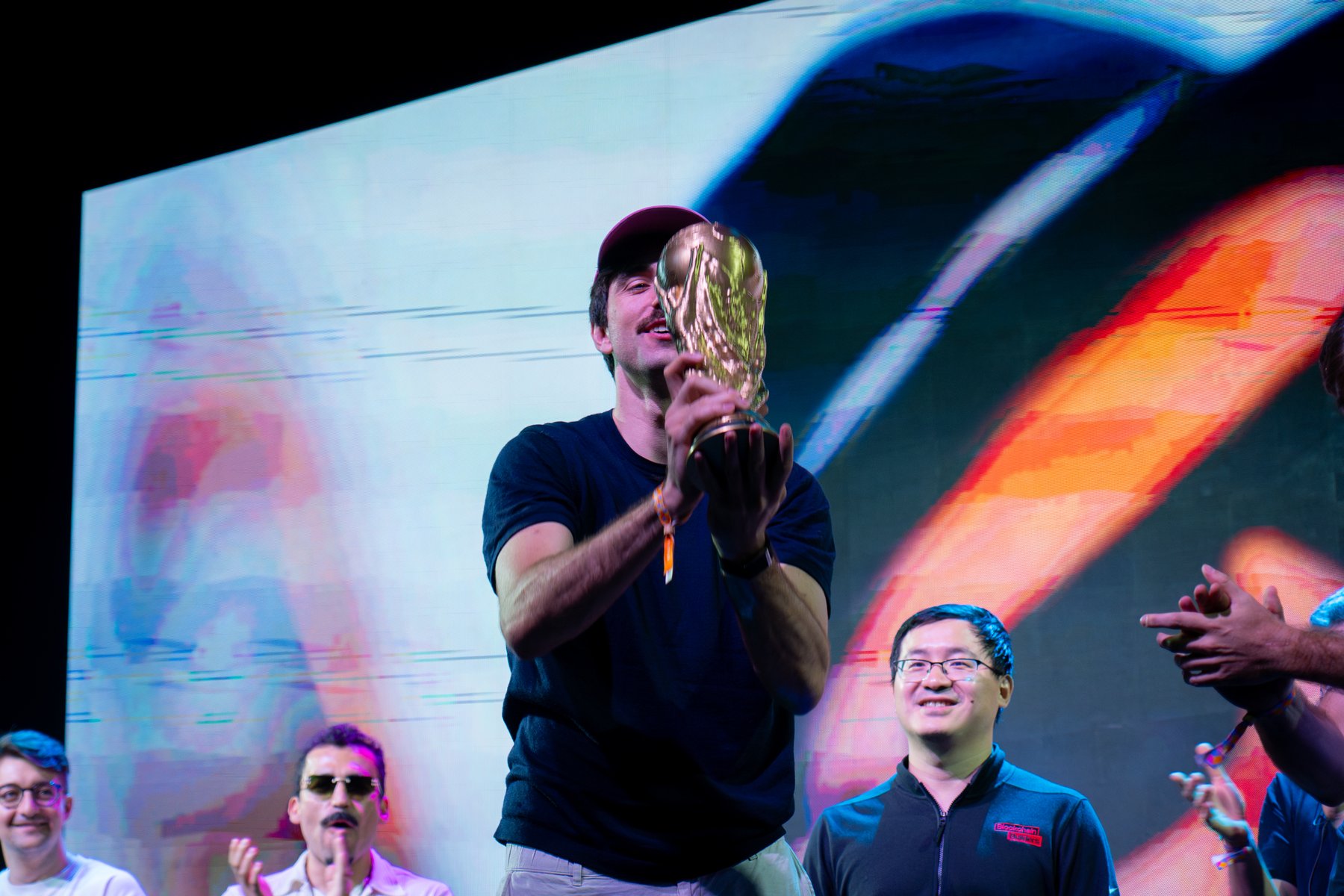 The cup held high on Devconnect's stage